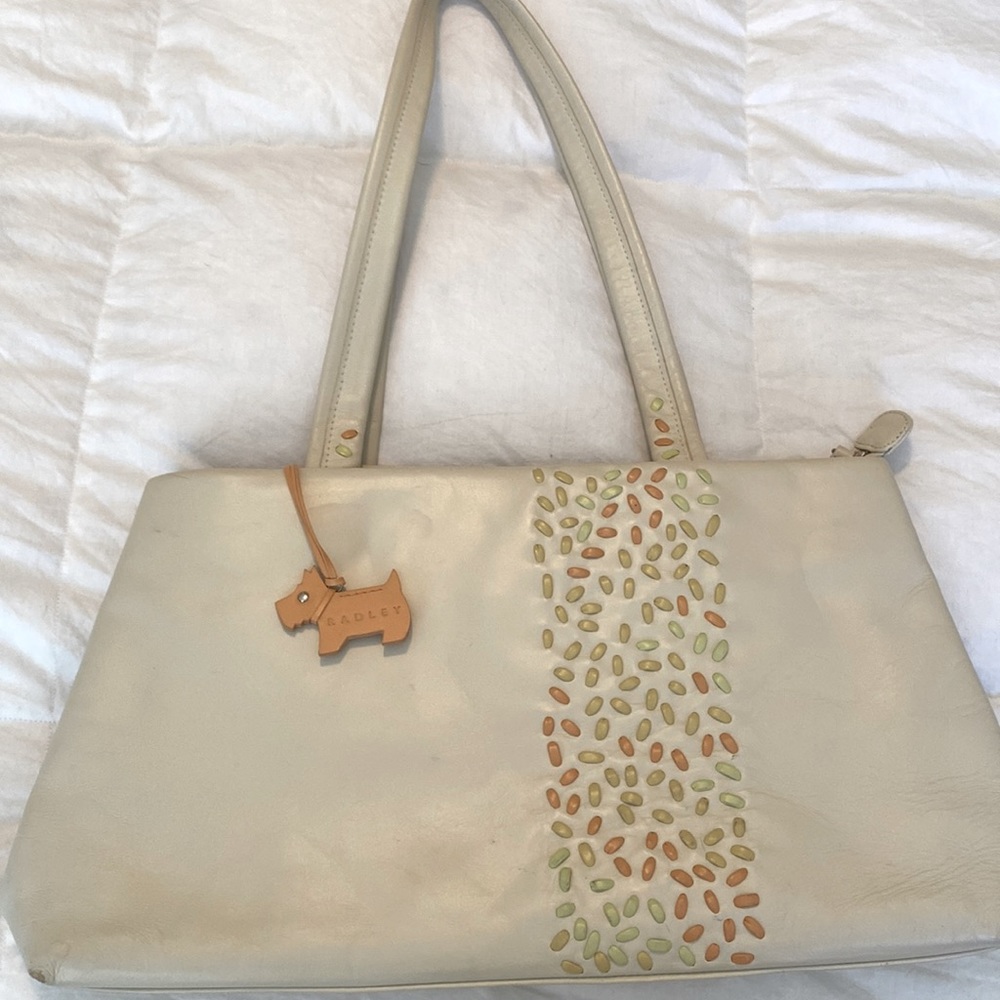 Radley spring bag, cream color and multi color accents.